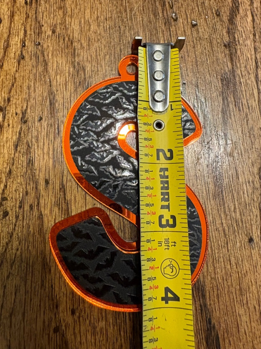 Source Unknown Orange and Black S-Shaped Reflective Tag
